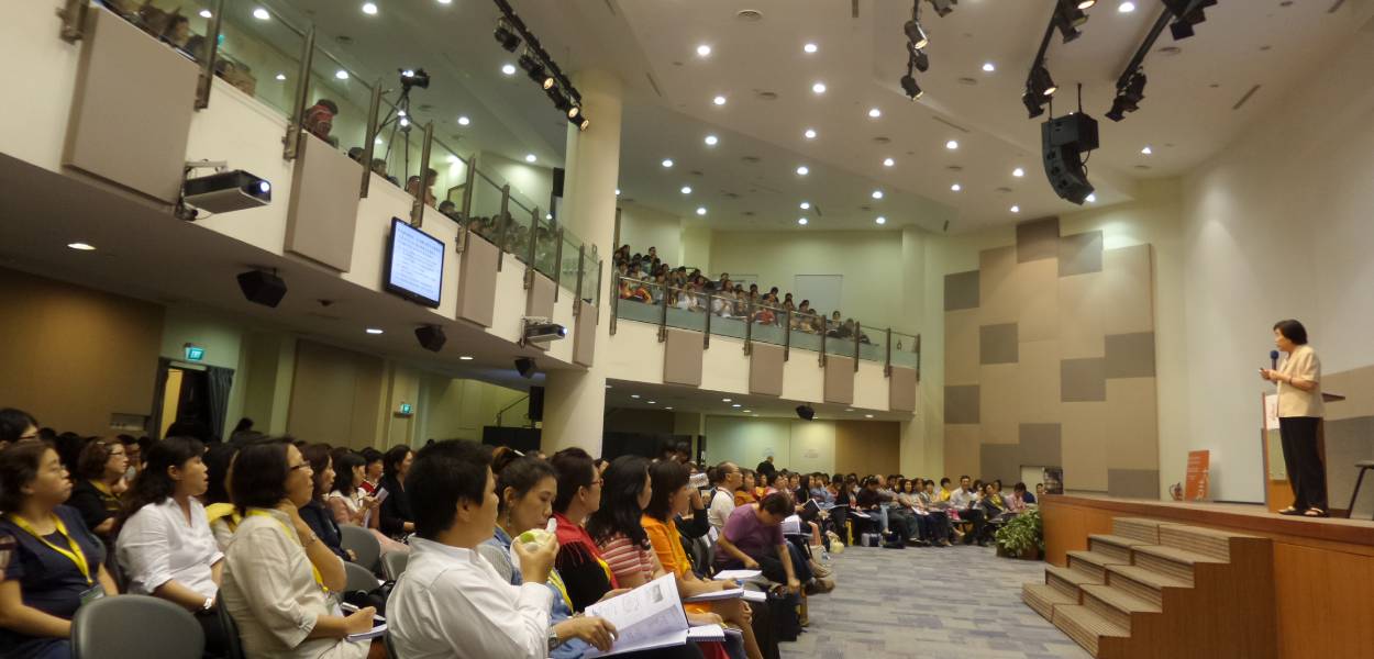 A speaker addressing a big audience
